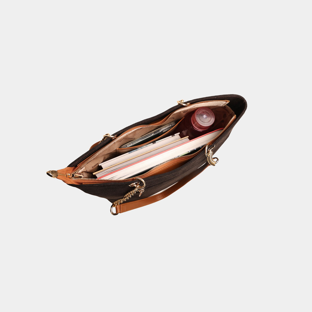 Interior of dark brown Stella handbag showing main compartment