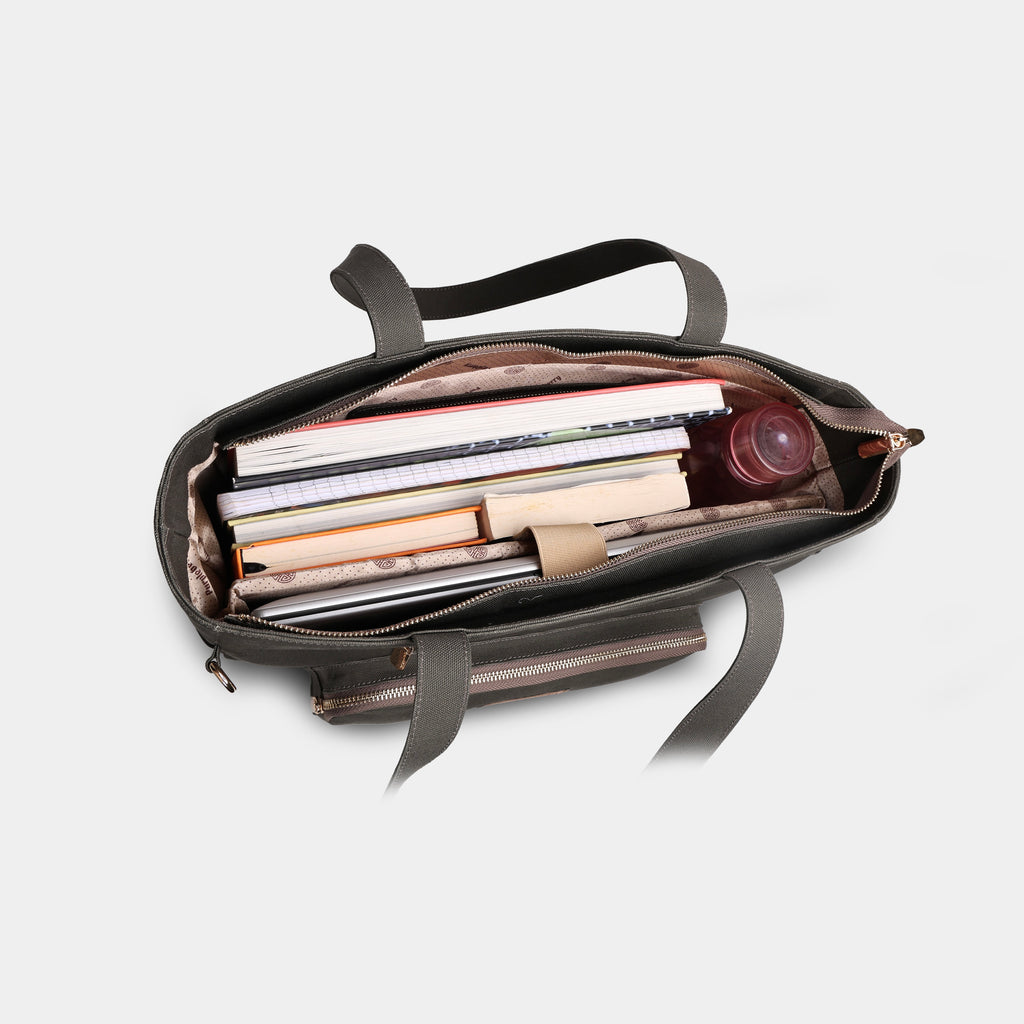 Interior of olive green canvas tote with padded laptop compartment