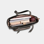 Interior of olive green canvas tote with padded laptop compartment