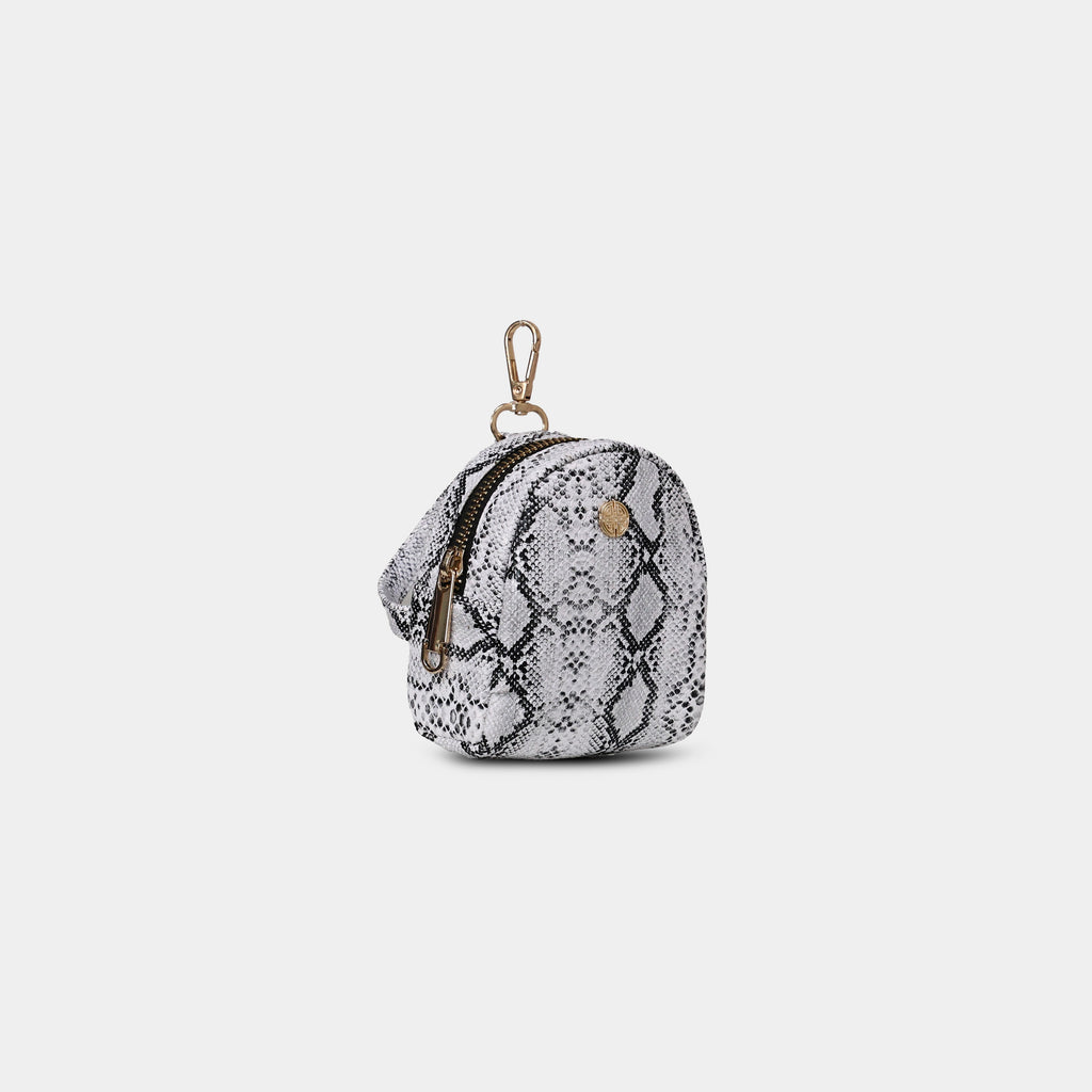 Side profile of Purpleberry Viper white snake print mini backpack
