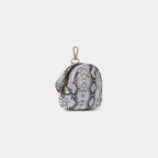 Side profile of Purpleberry Viper white snake print mini backpack