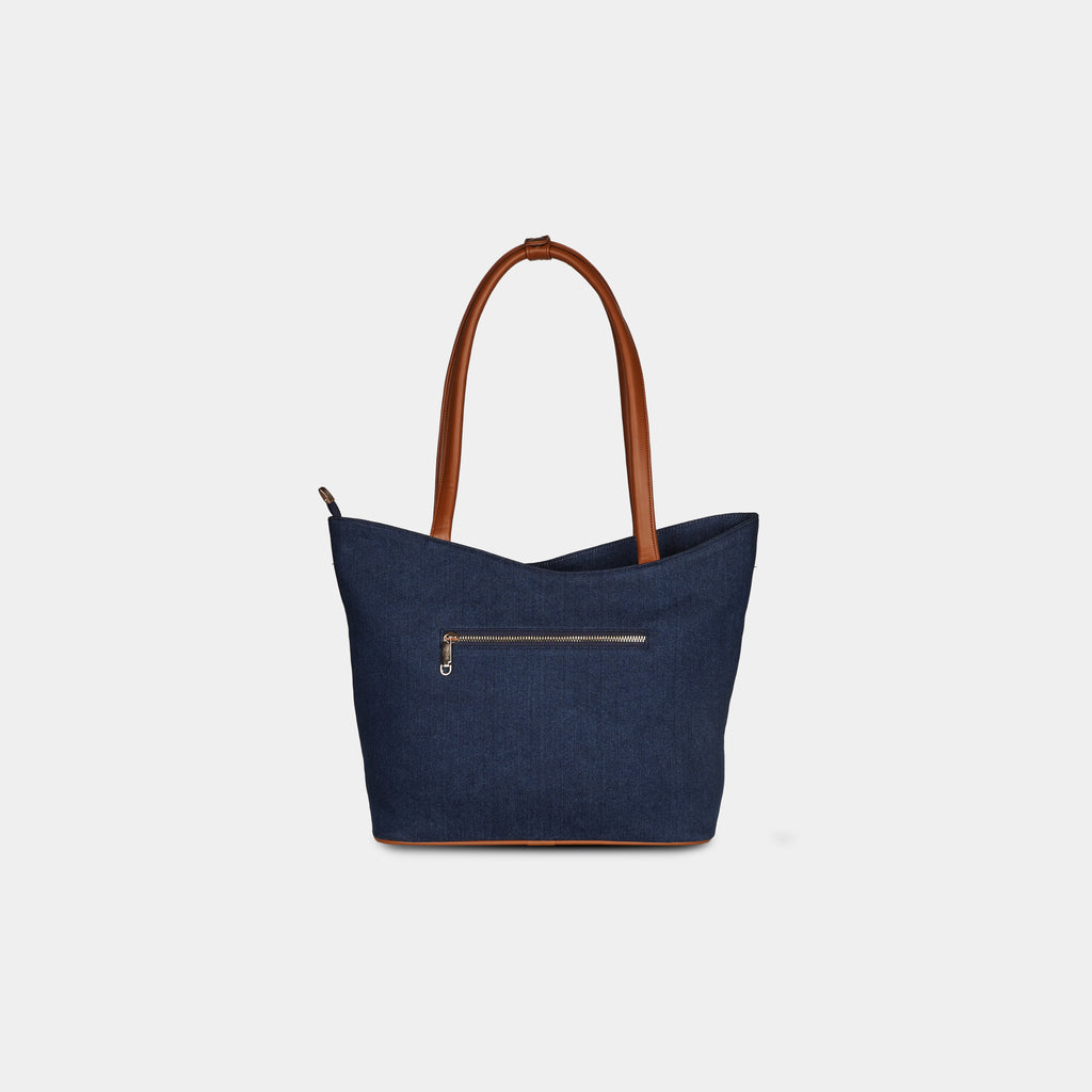 Back view of blue geometric denim bag with zipper pocket