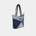 Side angle of light blue color-block denim handbag
