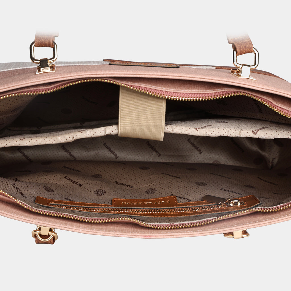 Interior of Terra pink office tote showing padded 14 inch laptop sleeve with secure strap